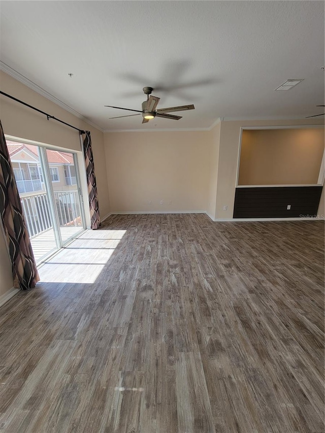 unfurnished living room with ceiling fan, ornamental molding, and wood-type flooring