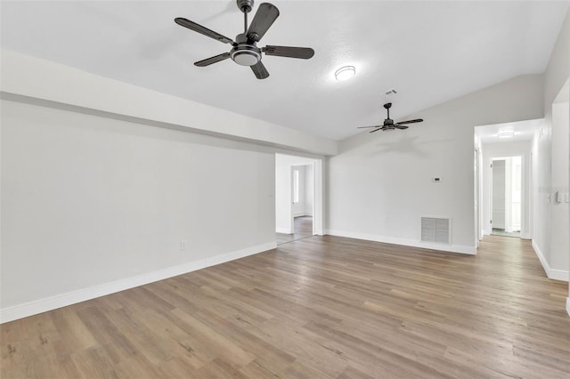 unfurnished living room with ceiling fan, lofted ceiling, and light hardwood / wood-style floors