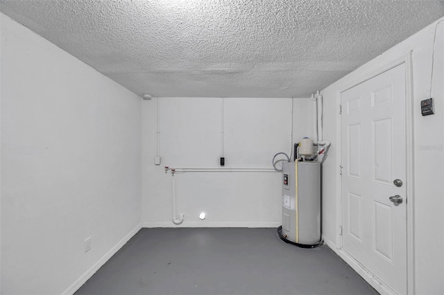 basement with water heater and a textured ceiling