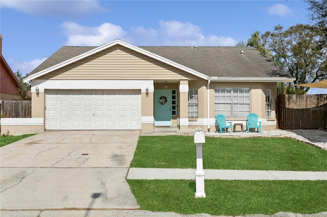 ranch-style home with a garage and a front yard