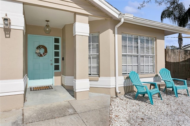 entrance to property featuring a patio