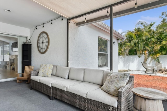 sunroom with beam ceiling