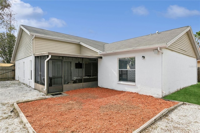 rear view of house with a sunroom