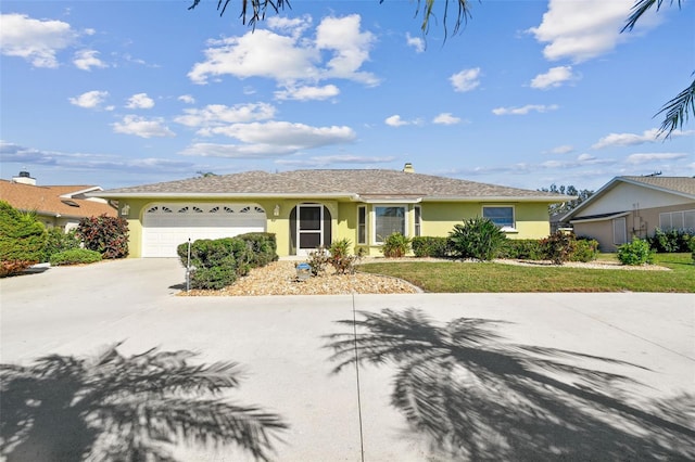 single story home featuring a garage and a front yard