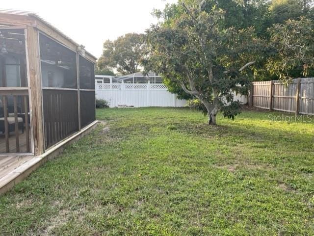 view of yard featuring a sunroom