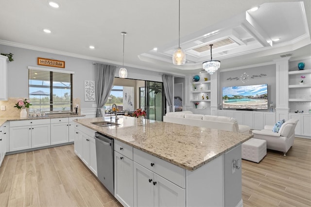 kitchen with crown molding, light wood-style flooring, stainless steel dishwasher, white cabinets, and a sink