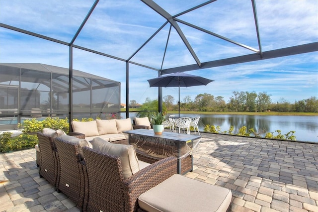 view of patio featuring a water view, a lanai, and outdoor lounge area