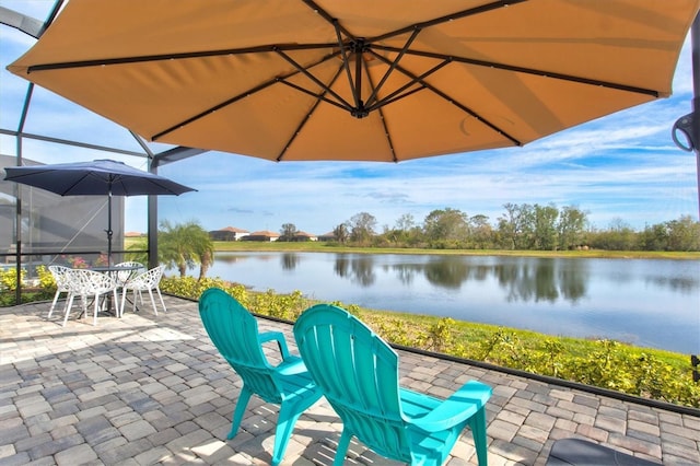 view of patio with outdoor dining space and a water view