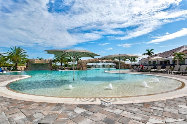 pool with a patio area