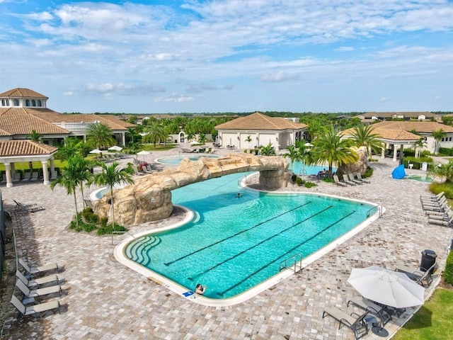 community pool featuring a gazebo and a patio area