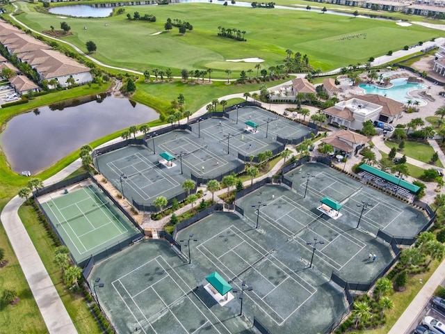 bird's eye view with a water view and view of golf course