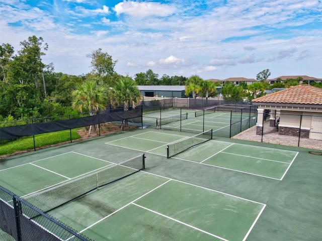 view of tennis court with fence