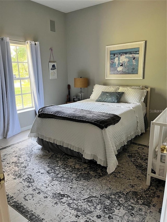 bedroom featuring tile patterned floors