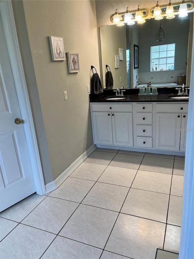 bathroom with tile patterned flooring and vanity