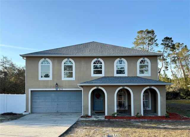 view of front of house featuring a garage and a porch