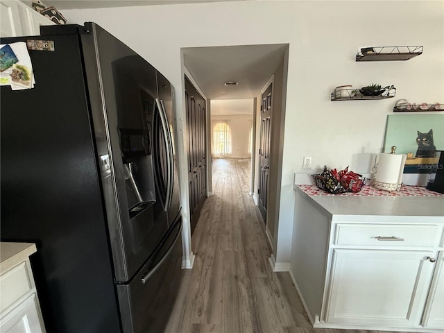 hall featuring light wood-type flooring