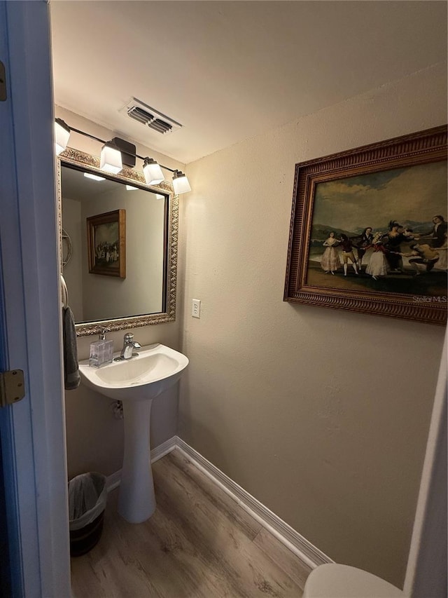 bathroom featuring sink and hardwood / wood-style flooring