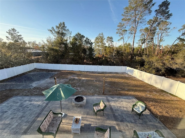 view of pool with a patio area and an outdoor fire pit