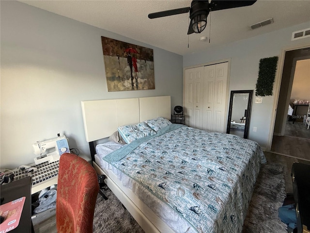 bedroom with ceiling fan and a closet