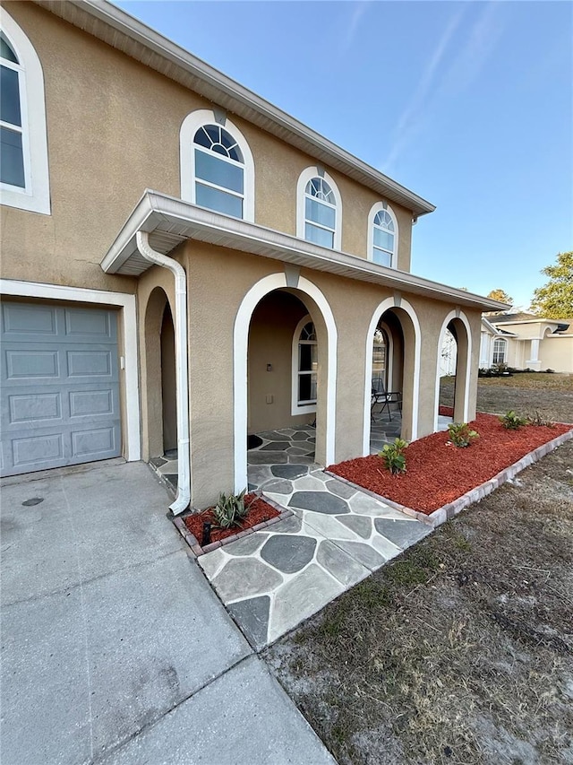 view of front of property with a garage and a porch