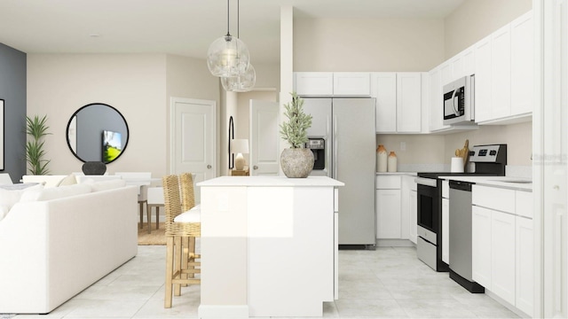 kitchen featuring stainless steel appliances, a center island, hanging light fixtures, and white cabinets