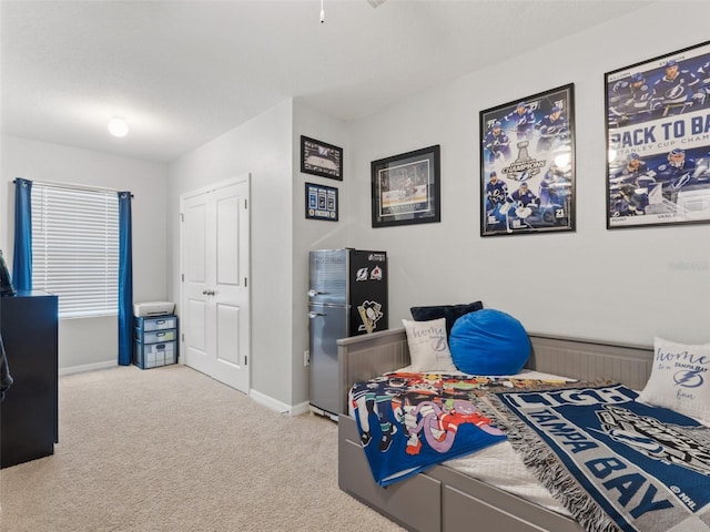 carpeted bedroom with baseboards