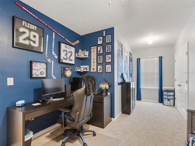 home office with baseboards and carpet floors