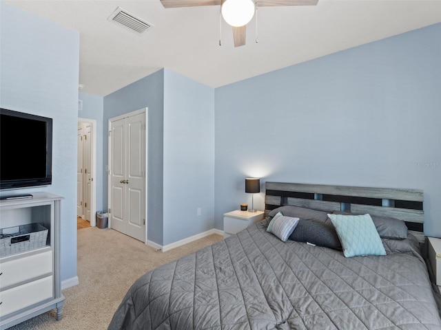 bedroom with visible vents, carpet flooring, baseboards, and ceiling fan