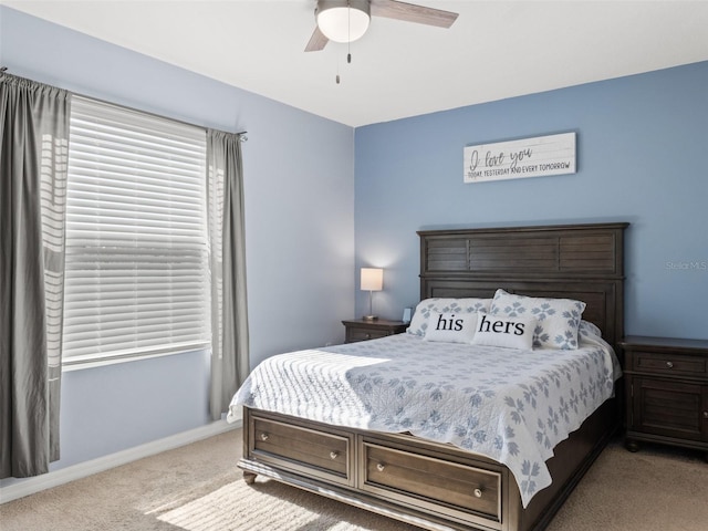 bedroom with light carpet and ceiling fan