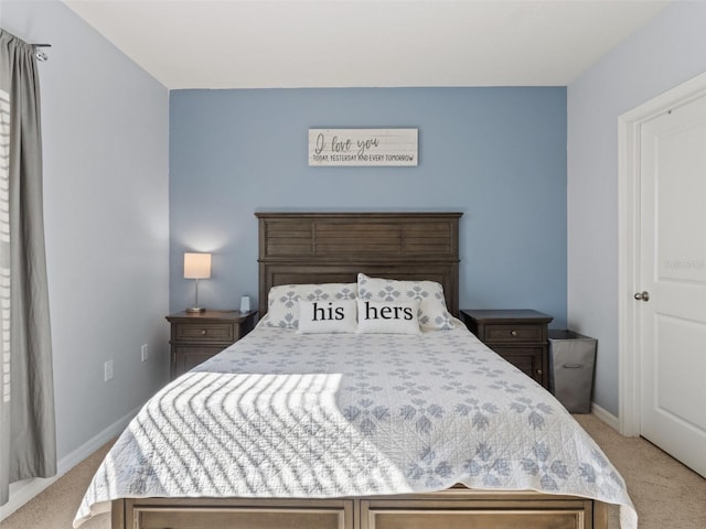 bedroom featuring baseboards and light carpet