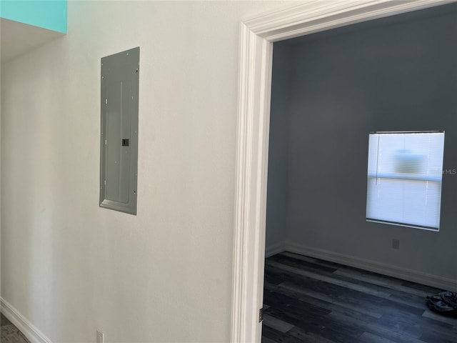 hall with electric panel and dark hardwood / wood-style floors