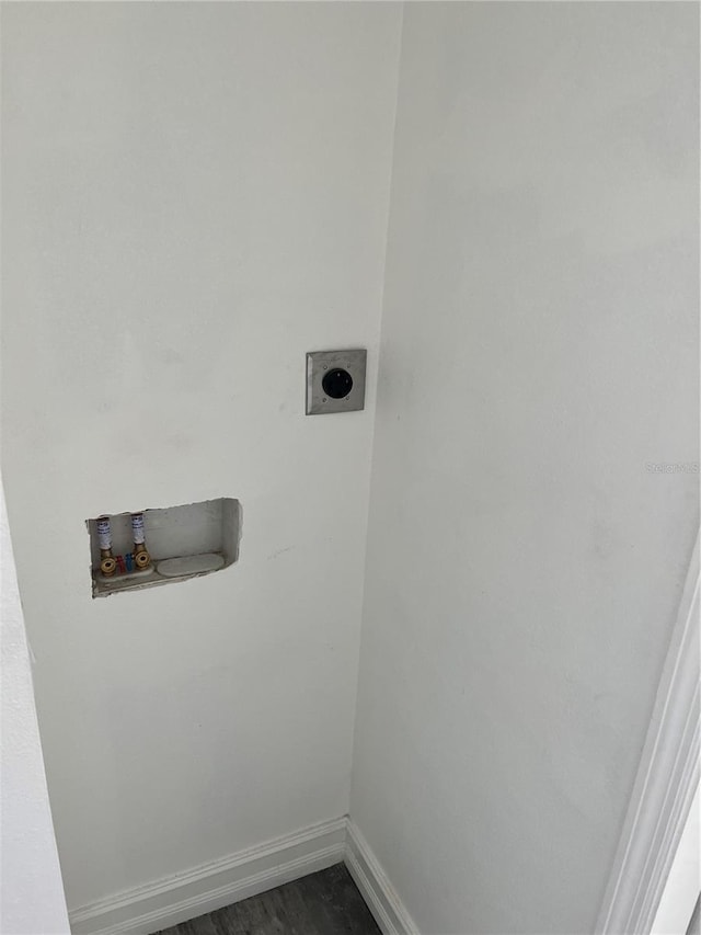 washroom with washer hookup, dark hardwood / wood-style flooring, and hookup for an electric dryer