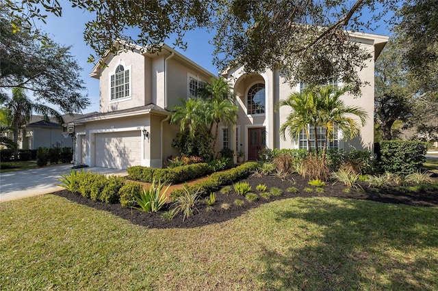 view of front of house with a garage and a front lawn