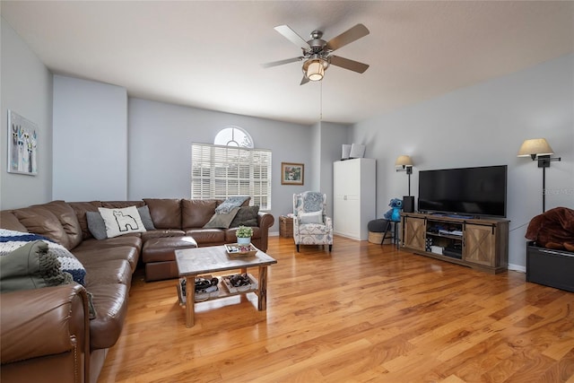 living room with ceiling fan and light wood-type flooring