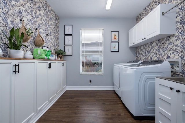 laundry room with cabinets, dark hardwood / wood-style floors, sink, and independent washer and dryer