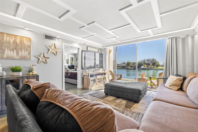 living area featuring expansive windows, a water view, and visible vents