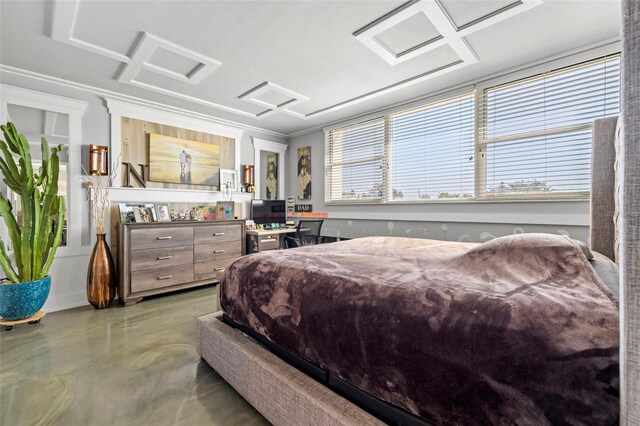 bedroom with concrete floors and attic access