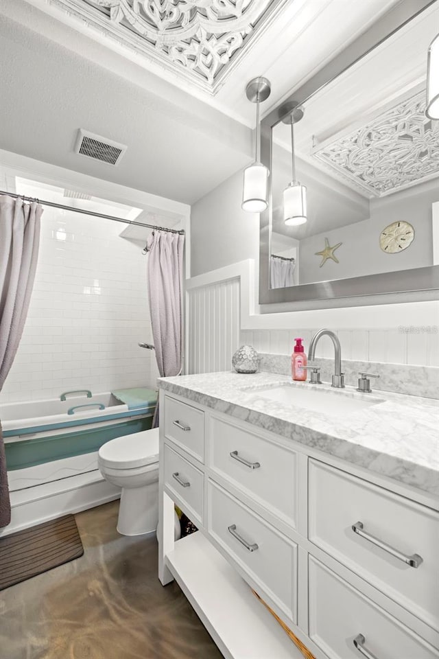 bathroom featuring visible vents, vanity, toilet, and shower / tub combo