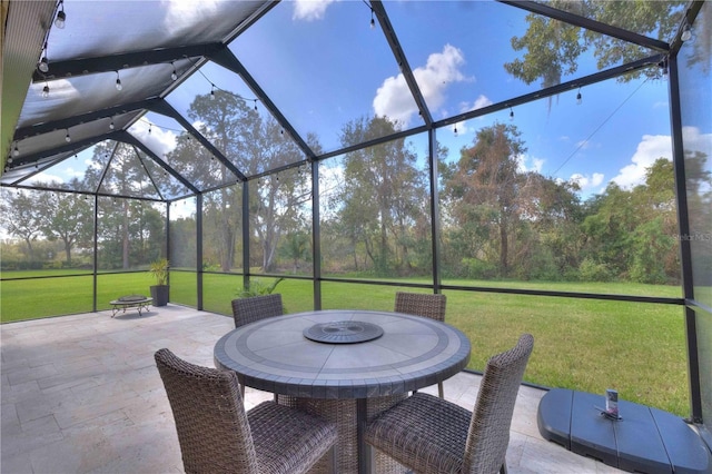 view of patio / terrace featuring a lanai