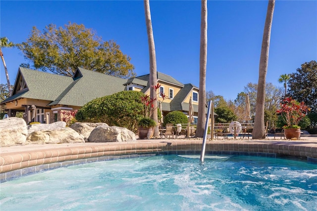 view of swimming pool featuring pool water feature