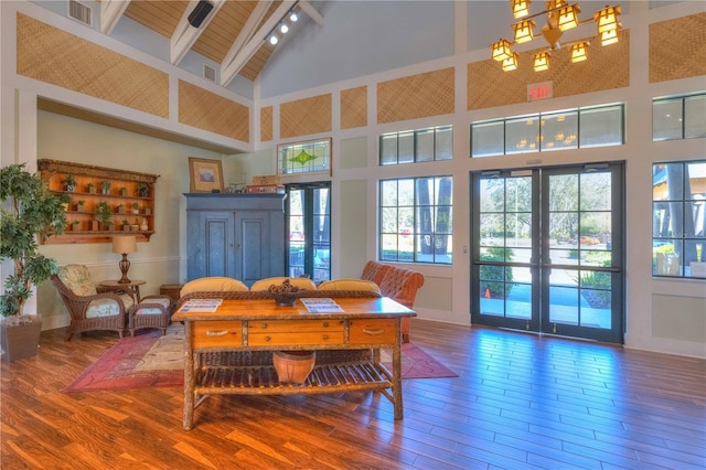 dining space with french doors, beam ceiling, high vaulted ceiling, and hardwood / wood-style flooring