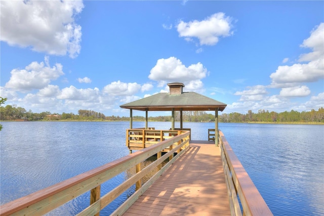 view of dock with a water view and a gazebo