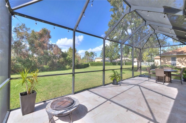 unfurnished sunroom featuring lofted ceiling