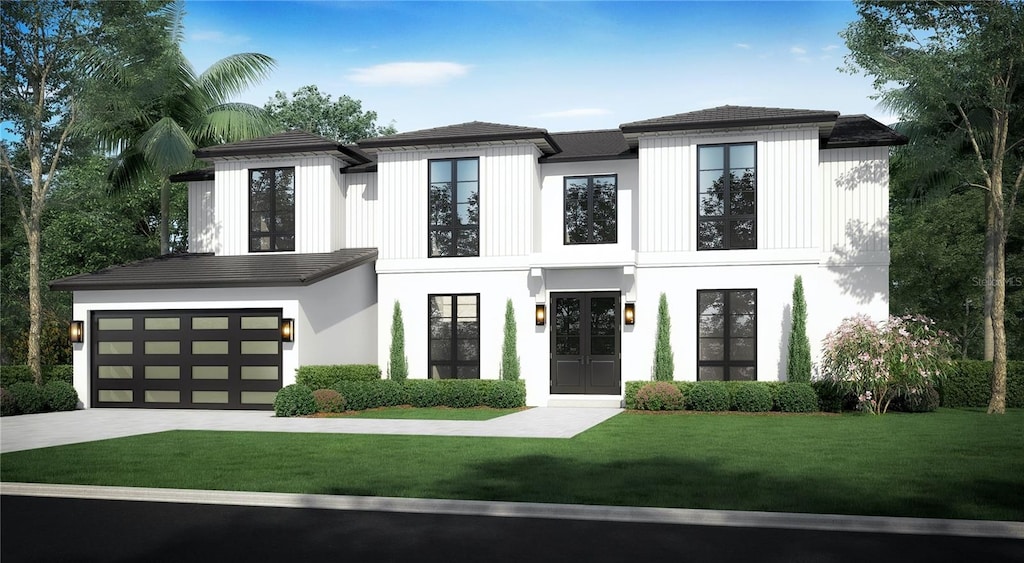 view of front facade with a garage and a front yard