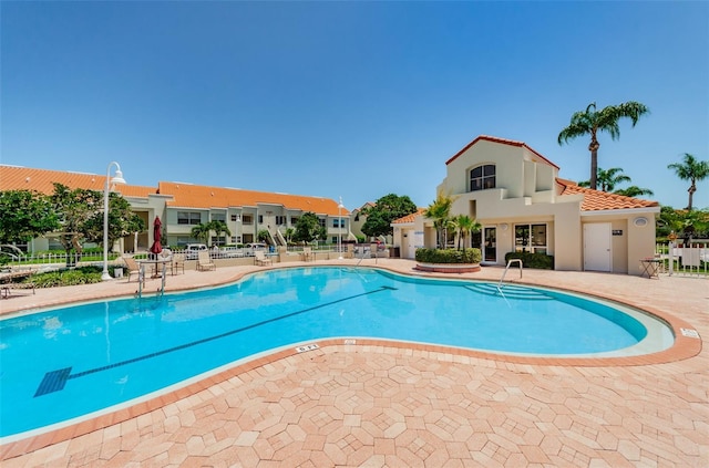 view of swimming pool featuring a patio