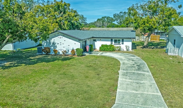 ranch-style home with a front lawn