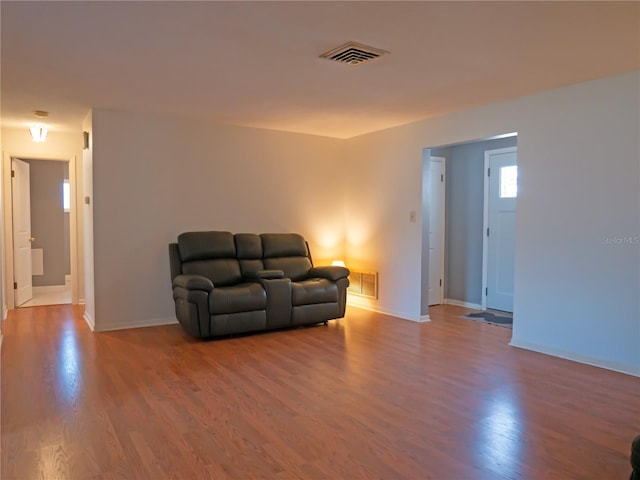 sitting room featuring wood-type flooring