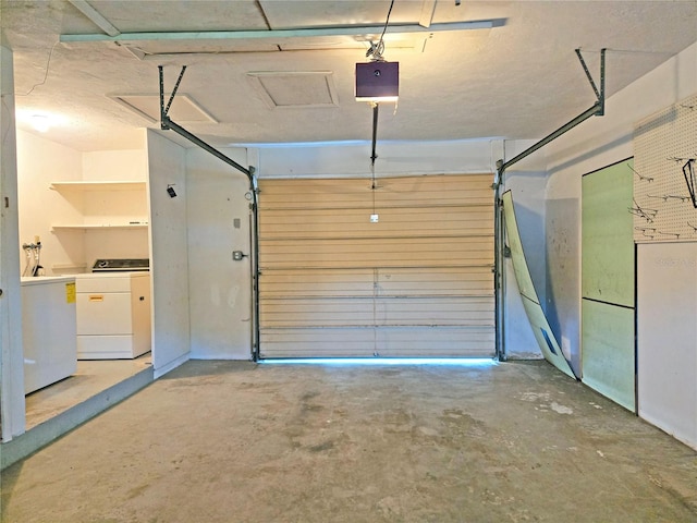 garage featuring a garage door opener and washing machine and clothes dryer