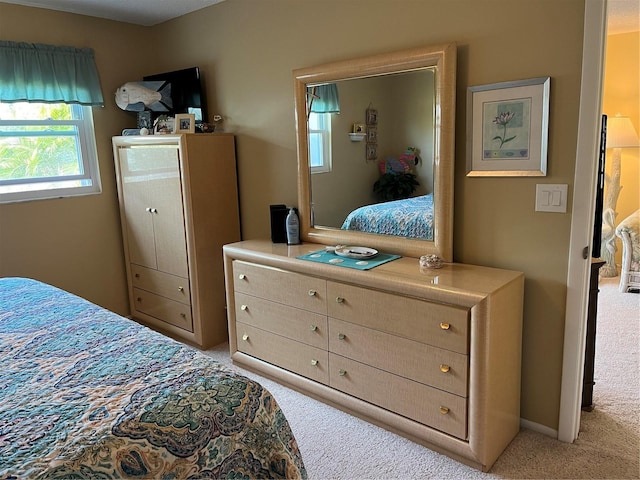 bedroom with light carpet