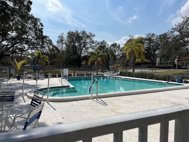 view of pool featuring a patio